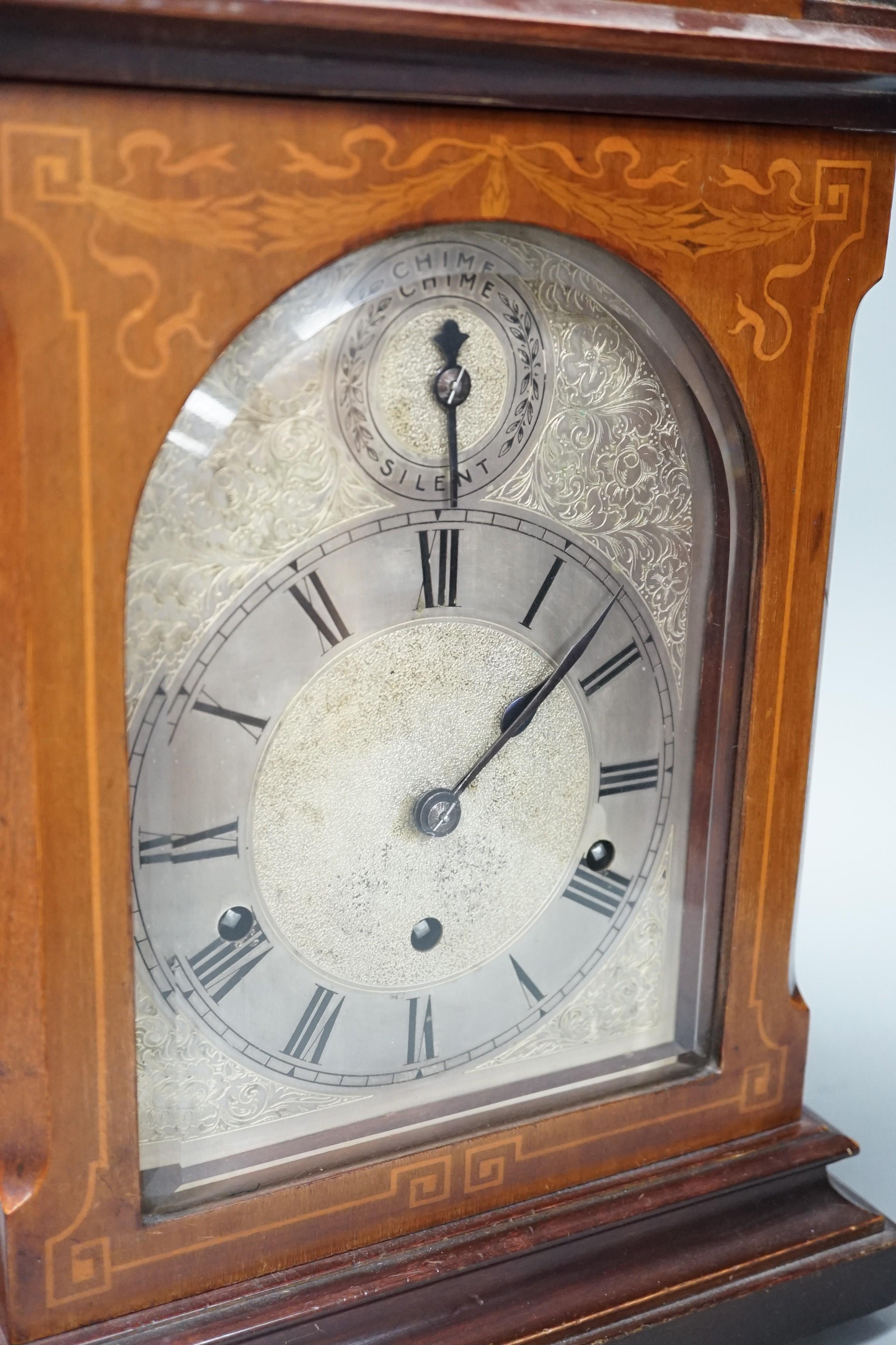 An early 20th century German walnut and marquetry chiming mantel clock, 42cms high